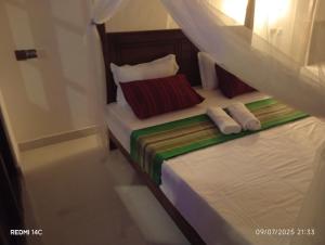 Voodi või voodid majutusasutuse Kurumba Lodge toas