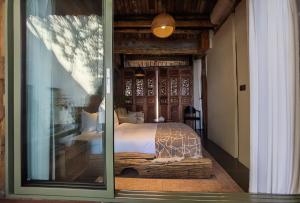 En eller flere senger på et rom på Yang Liping Xianguo'an Moon Palace Villa, Shuanglang, Dali