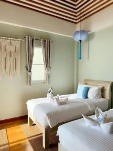 Ένα ή περισσότερα κρεβάτια σε δωμάτιο στο Blue Bay Villa +35 φωτογραφίες