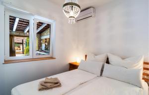 Posteľ alebo postele v izbe v ubytovaní Two-Bedroom Apartment In Ivan Dolac