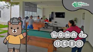 a group of people playing pool in a room at Vacation Home - Villa Konecta in Santiago de Cao +44 photos