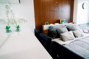 Voodi või voodid majutusasutuse The Aces Crib at Azure North Pampanga toas