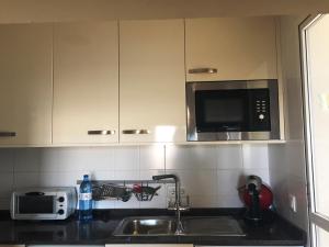Kuchyň nebo kuchyňský kout v ubytování Apartamento Rivas + 21 fotografií