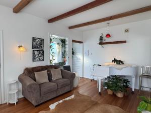 a living room with a couch and a table at White Oasis in Oamaru