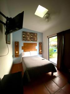 Postel nebo postele na pokoji v ubytování Posada Casa Topiltzin
