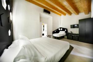 Voodi või voodid majutusasutuse Addauro Resort toas