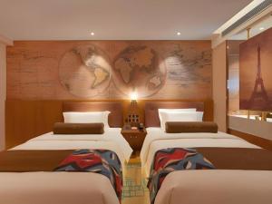 a room with two beds and a map on the wall at James Joyce Coffetel Beijing Tongzhou Guoyuan Metro Station in Beijing +221 photos