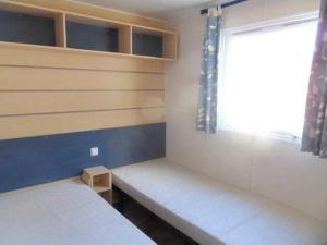 Ένα ή περισσότερα κρεβάτια σε δωμάτιο στο Camping 4 étoiles - Piscine - ccbbihi