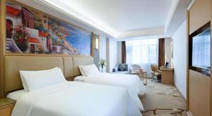 Postel nebo postele na pokoji v ubytování Vienna Hotel Hunan Ningyuan Jiuyi + 119 fotografií
