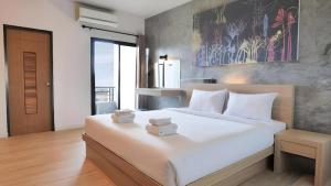 Кровать или кровати в номере B2 Chiang Rai Phahonyothin Boutique & Budget Hotel