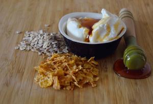 a bowl of food and chips with a bowl of ice cream at Fiscardo Bay Hotel in Fiskardo