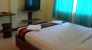 Postel nebo postele na pokoji v ubytování Lankham Hotel