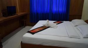 Postel nebo postele na pokoji v ubytování Lankham Hotel