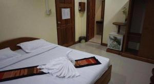 Postel nebo postele na pokoji v ubytování Lankham Hotel