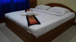 Postel nebo postele na pokoji v ubytování Lankham Hotel