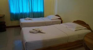 Postel nebo postele na pokoji v ubytování Lankham Hotel