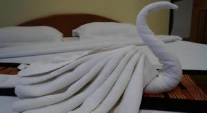 Postel nebo postele na pokoji v ubytování Lankham Hotel