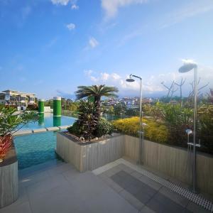 a view of a swimming pool on top of a building at The ReLuxe Baguio Suite CityHub in Baguio