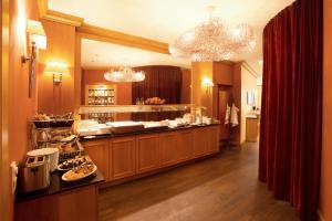 a kitchen with a counter with food on it at TOWNHOUSE Hotel in Frankfurt