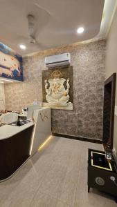 a kitchen with a counter and a sink in a room at Vraj in Vrindāvan +123 photos