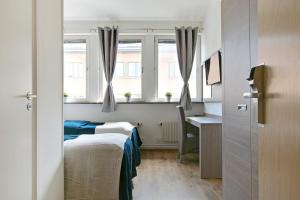 Postel nebo postele na pokoji v ubytování Hotel Kringelstaden