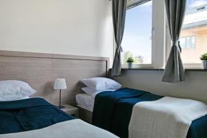 Postel nebo postele na pokoji v ubytování Hotel Kringelstaden