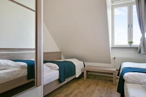 Postel nebo postele na pokoji v ubytování Hotel Kringelstaden