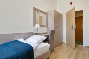 Postel nebo postele na pokoji v ubytování Hotel Kringelstaden