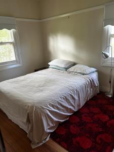 Кровать или кровати в номере Sandy Sky Blue Shack