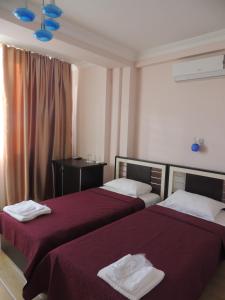 Ein Bett oder Betten in einem Zimmer der Unterkunft Hotel ''Premium Palace''