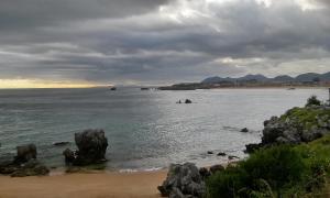 a view of a beach with rocks in the water at Hostal Isla Playa in Isla +19 photos