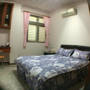 Postel nebo postele na pokoji v ubytování Sweetfishs Homestay