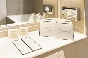 a counter with boxes on it in front of a mirror at Hotel Hamburger Hof in Frankfurt/Main +53 photos