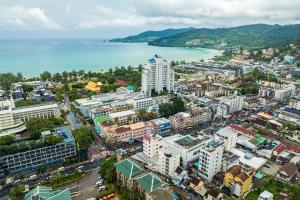 an aerial view of a city with a body of water at The Chic Patong Hotel in Patong Beach