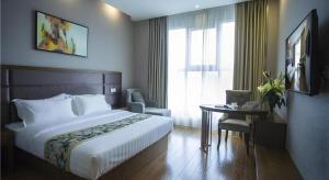 Ένα ή περισσότερα κρεβάτια σε δωμάτιο στο GreenTree Inn Taizhou Gaogang District Business Hotel
