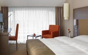 Postel nebo postele na pokoji v ubytování IntercityHotel Darmstadt + 24 fotografií
