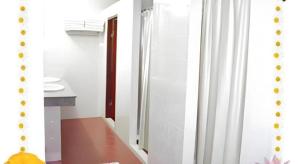 a bathroom with a toilet and a sink and a mirror at Phatad Valley Hotel in Ban Kui Mang +117 photos