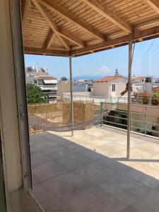 a view from the balcony of a house at Star lounge in Preveza +3 photos