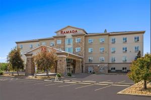 a rendering of a hotel with a parking lot at Ramada by Wyndham Drumheller Hotel & Suites in Drumheller