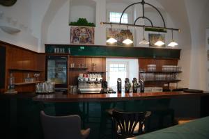 Nápoje v ubytovaní Hotel Der Greif