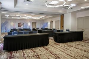 a large room with rows of tables and chairs at Hilton Garden Inn Hattiesburg in Hattiesburg