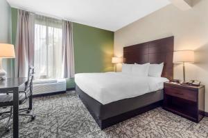 a hotel room with a bed and a desk at Quality Inn & Suites NJ State Capital Area in Morrisville +36 photos