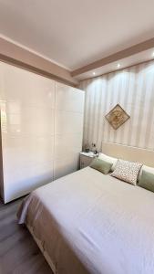 Ένα ή περισσότερα κρεβάτια σε δωμάτιο στο Appartamento Casa Patrizia +10 φωτογραφίες