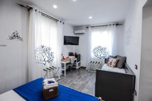 a living room with a couch and a table at Coral Rooms in Torre del Greco