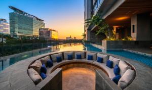 a swimming pool with pillows in a building at Casa Paradise at 31 Sudirman Suites in Makassar +3 photos