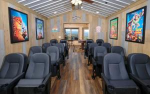 a room with chairs and a table in it at Bigger Bear Views Lodge in Gatlinburg