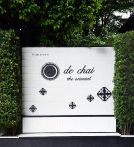 a sign that says do chan the original at De Chai Oriental Nimman - SHA Plus in Chiang Mai