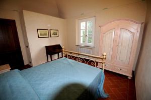 Ένα ή περισσότερα κρεβάτια σε δωμάτιο στο Relais Villa Sensano