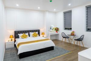 Postel nebo postele na pokoji v ubytování ROSA QUEEN HOTEL