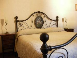 Postel nebo postele na pokoji v ubytování Relais Villa Sensano